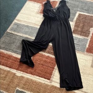 Elegant Black Jumpsuit with Embellished Neckline